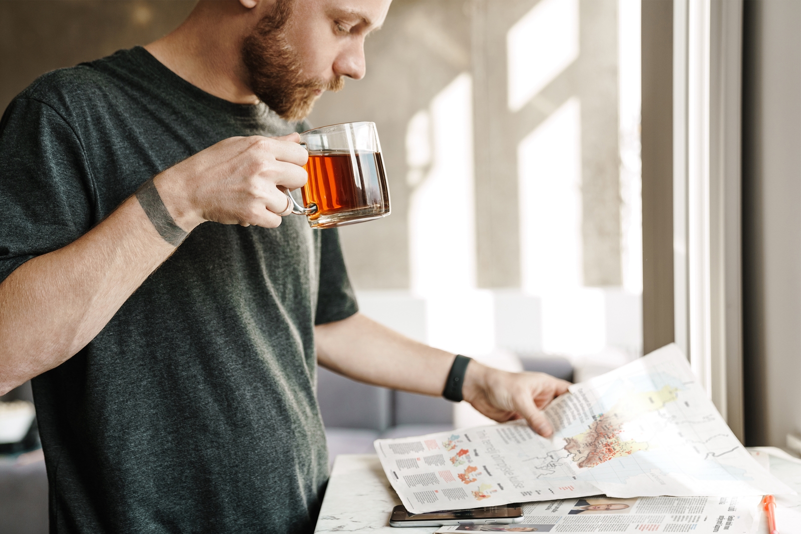 Reader enjoying a newspaper infographic